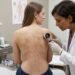 Bumpy Brown Patches on a Woman’s Torso Wiped Away with Alcohol, Revealing a New Form of a Dirt-Like Skin Condition